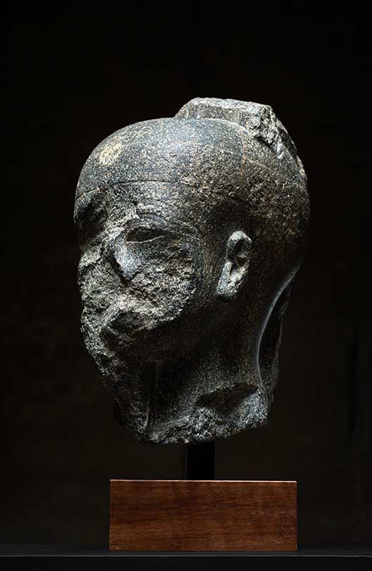 Axel Vervoordt, Wijnegem
Monumental head of Min
Granodiorite
31 x 19 x 26 cm (12.3 x 7.5 x 10.3 in.)
Egyptian, New Kingdom, Eighteenth Dynasty, reign of Amenhotep III 
(ca. 1388-1351 BC)