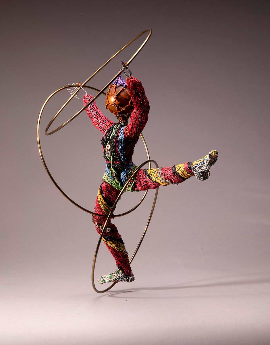 "Three-ring Pandemic Circus - Trapped Dancer" 2020
Galvanized & Plastic coated copper wire, Brass rings, Found objects.
18" x 12" x 11" inch
Fay Wood © All rights reserved. 