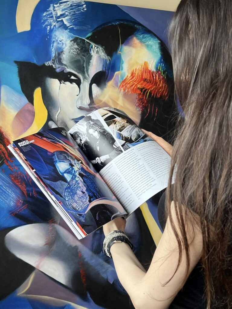 Enigma
150x100 cm, Acrylic and oil on canvas, 2023
Bianca Paraschiv with the printed edition of Art Market Magazine © All rights reserved.