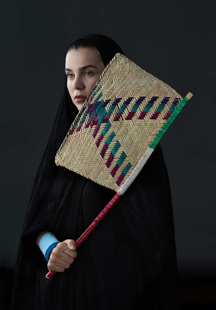Summer Olympic
This photo critically and humorously examines the issue of mandatory clothing for women in Iran. It was taken in the summer of 2024 to coincide with the Olympic event.
The photo shows a woman holding a windsurfer like a tennis or badminton racket and wearing a sports wristband on her hands. Withstanding the summer heat with this clothing is no less than an Olympic champion!
July 2024
Siavosh Ejlali © All rights reserved.