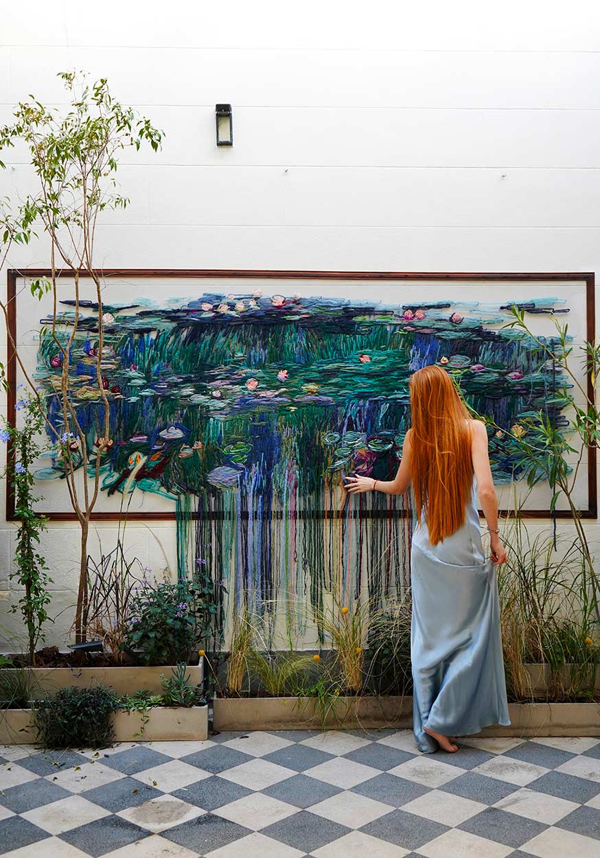 Kathrin Marchenko with the artwork, Nymphéas Beyond. 2026
Hand embroidery, thread on tulle
110 × 280 cm
© All rights reserved.