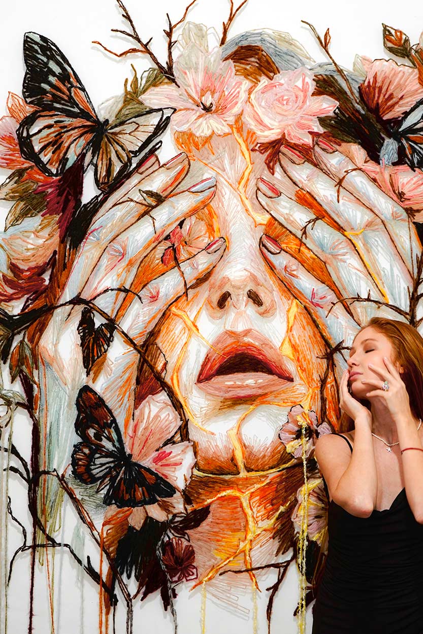 Kathrin Marchenko with the artwork Inherited Light. 2026
Hand embroidery, thread on tulle
134 × 168 cm
© All rights reserved.